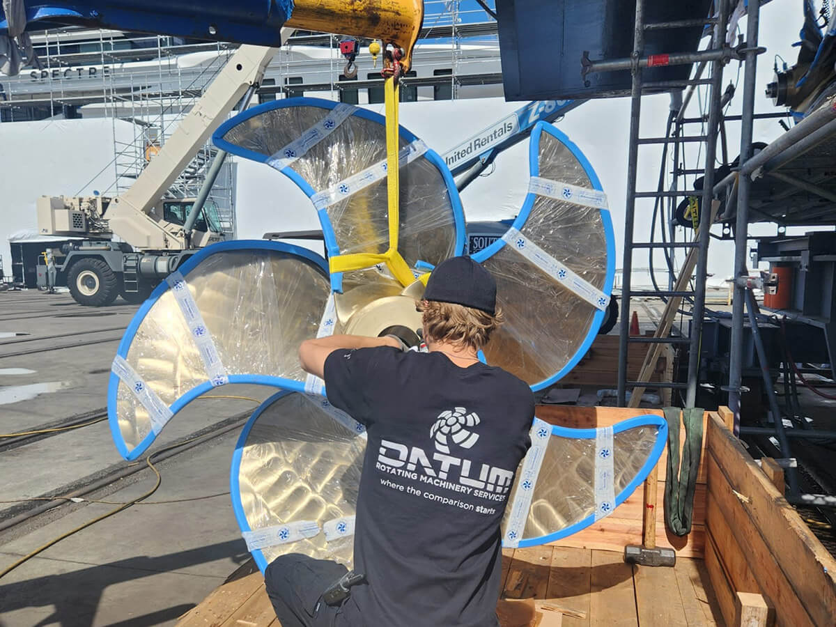 a datum technician working on a yacht propeller